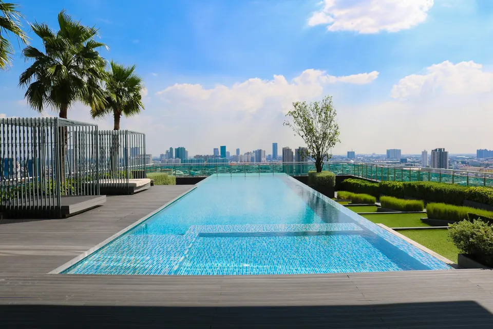Zero-edge lap pool surrounded by wood decking