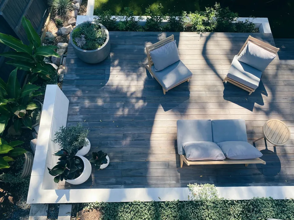 Aerial view of a stone terrace with outdoor furniture